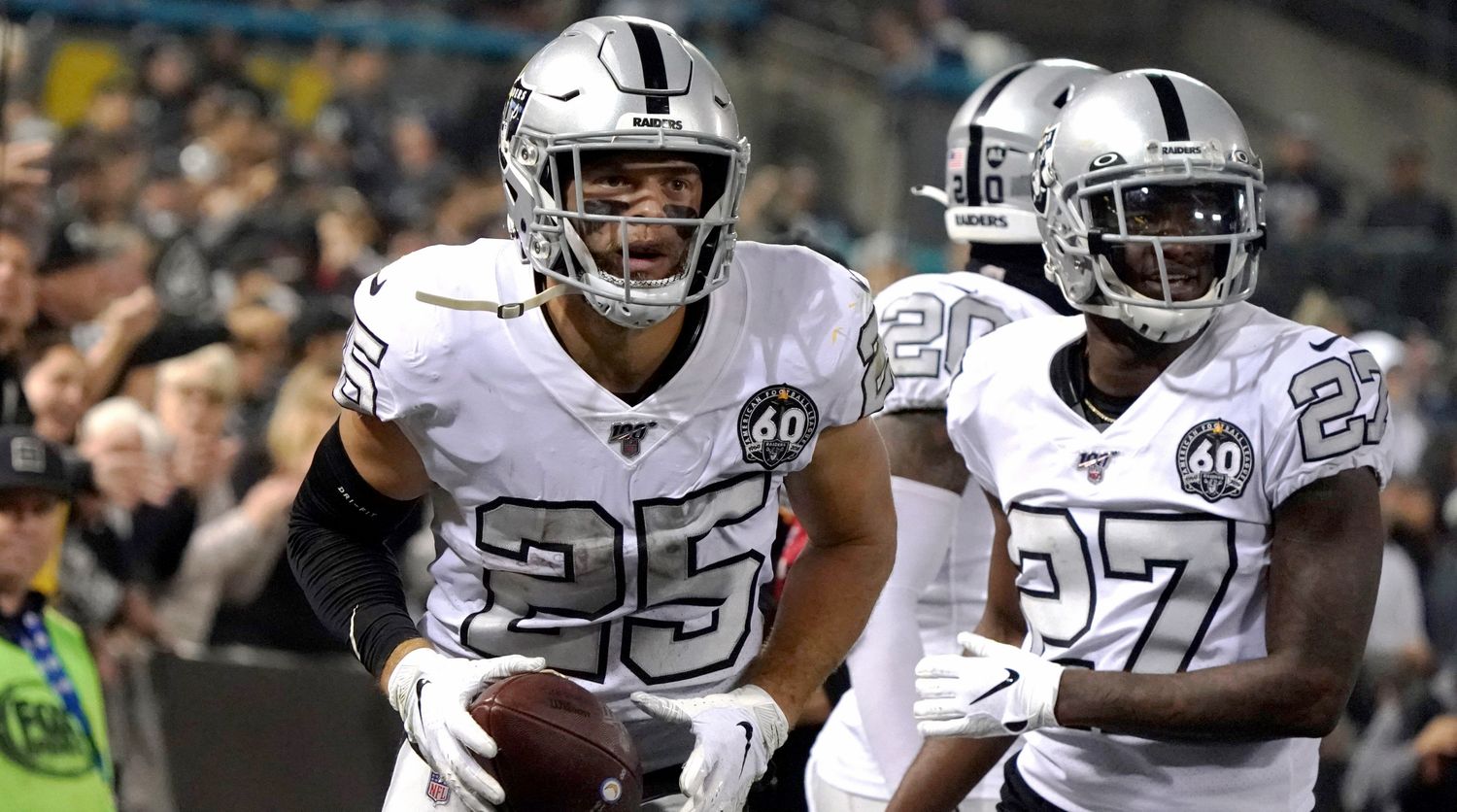 Nov 7, 2019; Oakland, CA, USA; Oakland Raiders free safety Erik Harris (25) celebrates with cornerback Trayvon Mullen (27) after intercepting a pass against the Los Angeles Chargers in the second quarter at Oakland-Alameda County Coliseum. Mandatory Credit: Kirby Lee-USA TODAY Sports